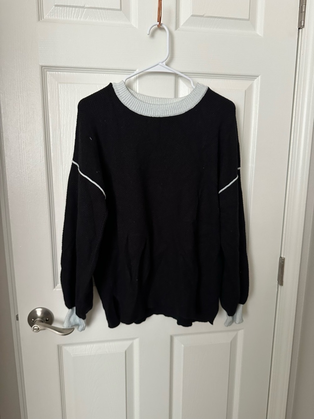 Cozy Black Crewneck Sweater with White Trim